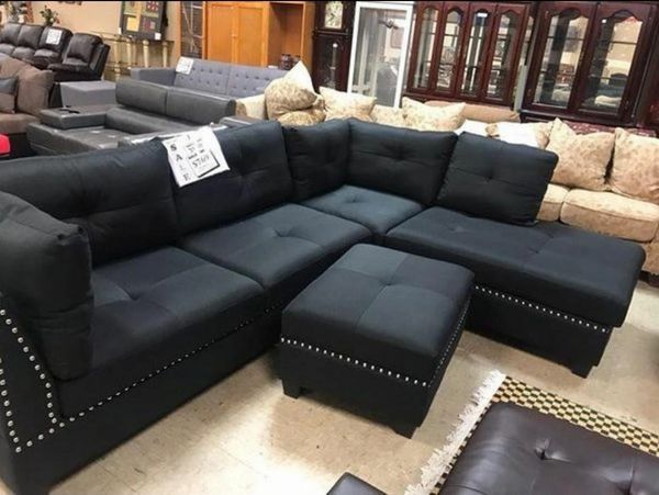 #2888 BLACK LINEN-LIKE SECTIONAL WITH NAIL HEAD & STORAGE OTTOMAN